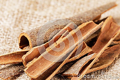 Close up of healthy Cinnamon Bark isolated on burlap background Stock Photo