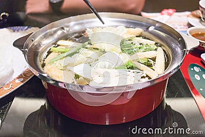 Close up healthy food on red pot from high angle view Stock Photo