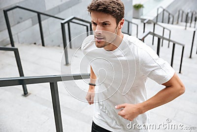 Close up of a healthy male runner in sport clothes Stock Photo
