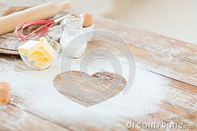 Close up of heart of flour on wooden table at home Stock Photo