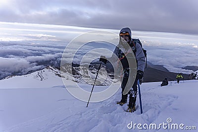 Close up hiker portrait on snowfield and mountain background Stock Photo