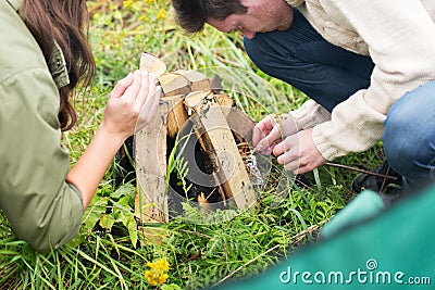Close up of hikers kindling fire Stock Photo
