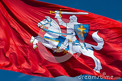 Close up of historic Lithuanian flag - Vytis waving in the wind on a sunny day. National flag of Lithuania - knight on a horseback Stock Photo