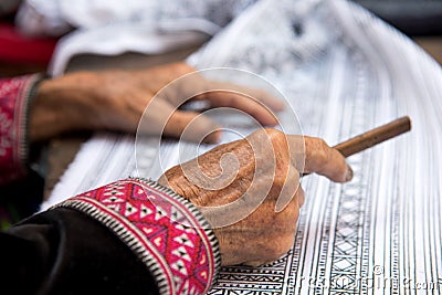 Close up Hmong hilltribe Writing candles to handmade batik in thailand Stock Photo