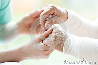 Close-up of holding hands Stock Photo