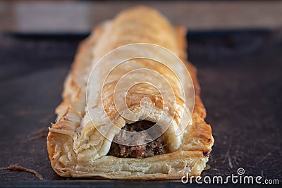 Home made sausage roll on dark backgroundc Stock Photo