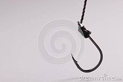 Hook attached to steel cable, single fish hook Stock Photo
