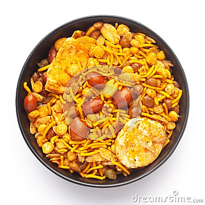 Close-Up of Hot spicy Nav Ratan snacks in a black Ceramic bowl, made with red chili, peanuts. Indian spicy snacks Namkeen, Stock Photo