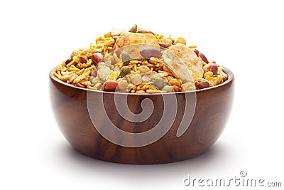 Close-Up of Hot spicy Nav Ratan snacks In hand-made handcrafted wooden bowl, made with red chili, peanuts. Indian spicy snacks Stock Photo