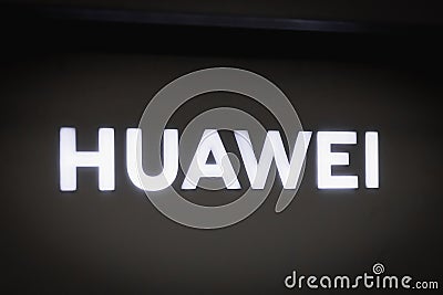 Close-up on the HUAWEI logo on a decorative wall in store Editorial Stock Photo