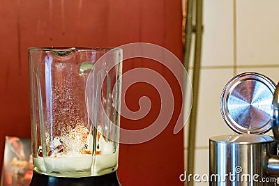 Blender with of ice cream close. Preparing smoothie Stock Photo