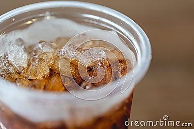 Close up of ice cubes with cola in the plastic glass Stock Photo