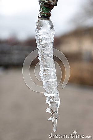 Close-up of icicle hanging from tap Stock Photo