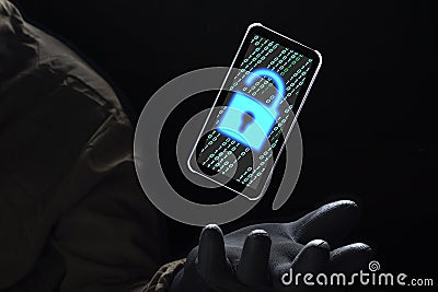 Close up illuminate unlock icon with green binary code on screen of smartphone floating above of hacker`s hand in black glove on Stock Photo