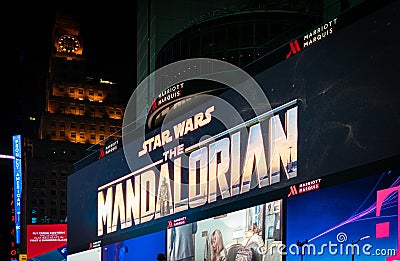 Close up on illuminated billboard at Times Square showing the New Disney plus series The Mandalorian. Editorial Stock Photo