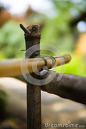 Close-up image of an array of wooden sticks bound together with rope Stock Photo
