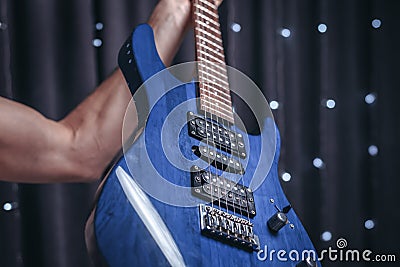 Close-up image of a blue electric guitar Stock Photo