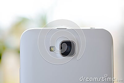Close Up Image of the Camera of White Smart Phone Stock Photo