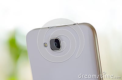 Close Up Image of the Camera of White Smart Phone Stock Photo