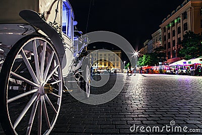 Close up image carriage wheel on main square of olf city in Krakow Editorial Stock Photo