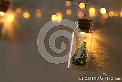 close up image of Christmas tree in the masson jar garland light. Stock Photo