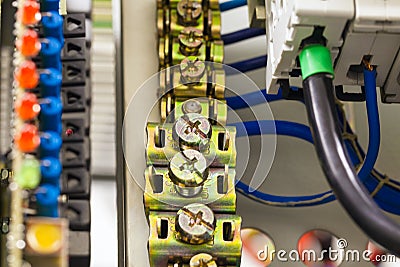 Close-up image of electrical wires is connected to cuprum clamps in power system of direct voltage with electrical Stock Photo