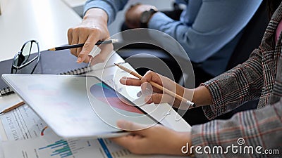 Female boss and marketing officer checking the report Stock Photo