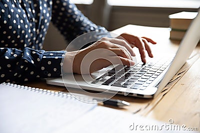 Close up view image female hands typing on laptop keyboard Stock Photo