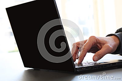 Close-up image of a finger touching texting on keyboard on a laptop computer. Stock photo with white background for copy Stock Photo