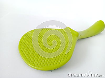 Close-up image of a green plastic rice spoon Stock Photo