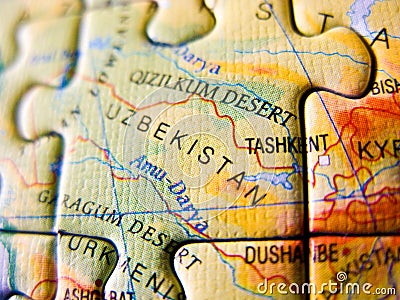 Close up of a jigsaw puzzle map depicting Uzbekistan Editorial Stock Photo