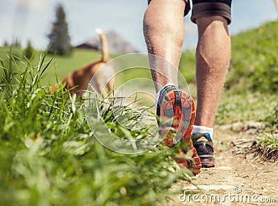 Close-up image of a men's legs during the mountain walk Stock Photo