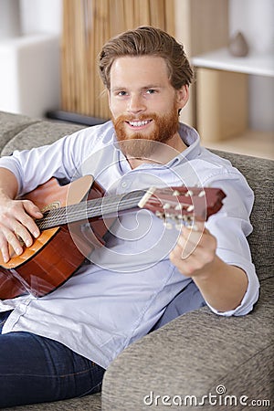 Close-up image musician tunning guitar Stock Photo