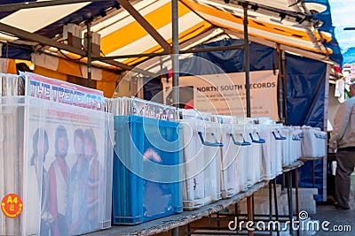 Close-up image of nostalgic vinyl records from various artists seen been sold in an outdoor market. Editorial Stock Photo
