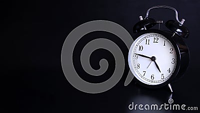 Close up image of old black vintage alarm clock. Four o`clock and forty-five minutes Stock Photo