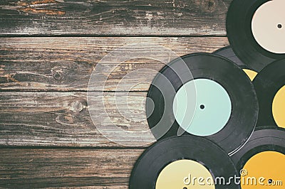 Close up image of old records over wooden table , image is retro filtered . Stock Photo