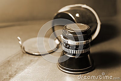 Close up image of old vintage dusty lens with box on blurred background, selective focus. Stock Photo