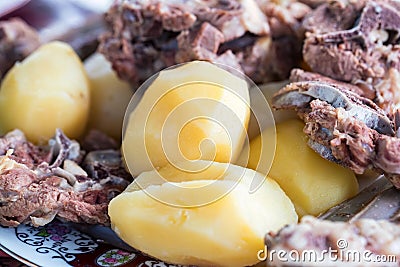 Boiled lamb meat and whole potatoes close up Stock Photo