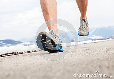 Close up image runner legs in running shoes Stock Photo