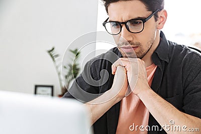 Close up image of serious handsome man in eyeglasses Stock Photo