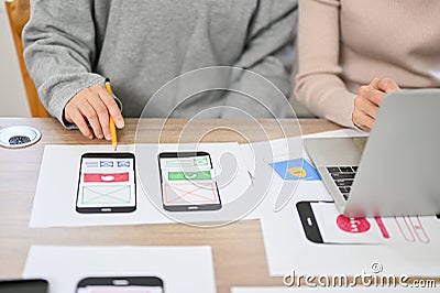 Close-up image, Team of professional mobile application developers checking their new prototype Stock Photo