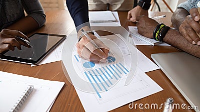 Close up image young businessman editing paper documents. Stock Photo