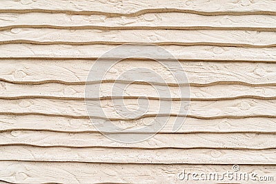 Close up, imprint of wood texture on concrete. Vanilla dyed Stock Photo