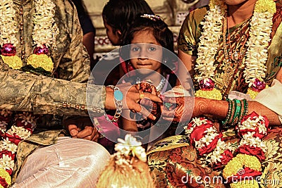 Close up of Indian couples hands at engagement ceremony Stock Photo