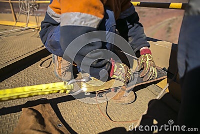 Rope access worker commencing safety final checking inspecting of black rope protection Stock Photo