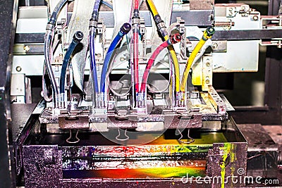 Close-up of inkjet printers in large machines.Colorful background Stock Photo
