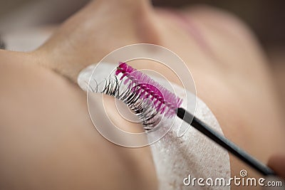 Close-up of the insertion of artificial eyelashes Stock Photo