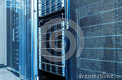 Close up inside data server room. High capacity hard drive disk storage rack. Blade server in datacenter. Stock Photo