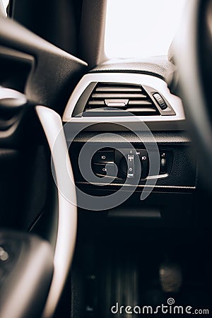CLose up interior of modern car, details of light switch and ventilation holes Stock Photo
