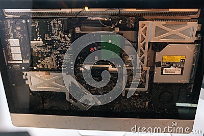 Close-up of intricate internal components of nettop computer, showcasing complexity of motherboard, hard drive, cooling Stock Photo